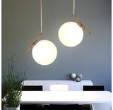 Brass white glass stem pendant light with ball 